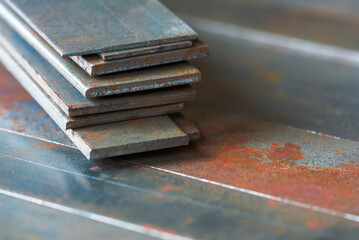 Stack of rusty steel flat bar, metallurgy industry