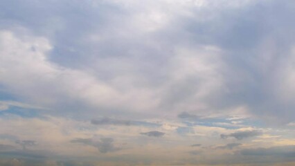 Wall Mural - The sky at sunset is almost completely covered with clouds. Delicate background with clouds.