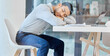 Man, sleeping and tired at desk in startup with burnout, exhausted and overworked at creative agency. Employee, person and rest with fatigue, overtime and overwhelmed in modern office with nap at job