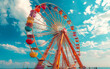 © Анна Терелюк - Ferris wheel on the beach. A colorful ferris wheel set against the backdrop of a blue sky