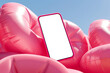 Smartphone mockup on pink inflatable background. Mobile phone with blank screen on summer vacation. App mockup