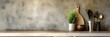 A homey kitchen scene with utensils and fresh herbs lined up against a textured wall, invoking warmth and cooking inspiration