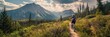 © gunzexx png and bg - An active mountain biker rides along a serene forest trail, framed by majestic mountains and vibrant skies at dusk