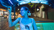 Asian woman traveler transpotation via tuk tuk local taxi enjoy night life travel in Bangkok city, Thailand