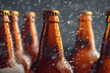 Beer bottles with drops of water on dark background, closeup view