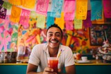 Fototapeta Zwierzęta - 
Portrait shot of a person enjoying a refreshing glass of horchata at a traditional Mexican taqueria, with colorful papel picado decorations hanging from the ceiling