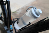 Fototapeta Konie - Close-up of a water bottle on a bicycle