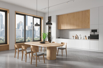 A modern kitchen interior with wooden dining table, chairs, and city view through large windows, light background, concept of home design. 3D Rendering