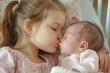 © GustavsMD - Portrait of big sister cuddling newborn, little baby. Newborn baby sleeping with his sister, kissing her on the forehead. Sisterly love, joy for new family member.