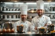 Two professional chefs stand proudly in a commercial kitchen setting with cooking equipment