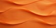 Orange linen fabric with abstract wavy pattern. Background and texture for design, banner, poster or packaging textile product. Closeup. with copy space 