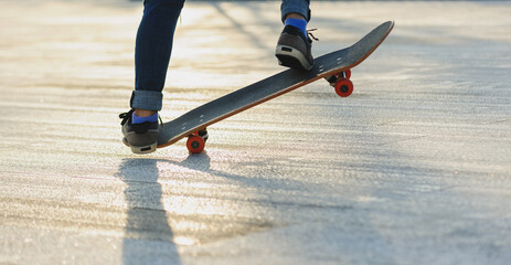 Wall Mural - Skateboarder skateboarding outdoors in sunshine