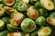 Delicious roasted Brussels sprouts as background, closeup