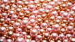 Background of golden pearls close-up, selective focus