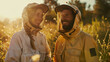 © chekart - A happy man and woman in beekeeper costumes are enjoying their work. Beekeepers at the apiary