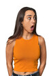 Hispanic young woman being shocked because of something she has seen.