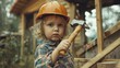 Young child playing construction worker with toy hammer