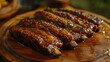 golden colored juicy roasted spare ribs on a wooden plate
