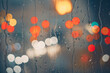 raindrops on the window and multi colored street lights at night background