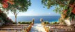 A beautiful outdoor wedding venue with a view of the ocean. There are palm trees and flowers lining the aisle, and the benches are decorated with white and pink flowers. The sun is shining and the wat