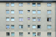 grey dirty facade of a family living apartment house