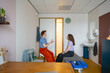 © Connect Images - Medical consultation between a practitioner and a patient in a clinic room.