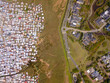 © fivepointsix - Aerial poor township and rich suburb in South Africa