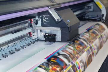 Wall Mural - large format printing machine in operation.
