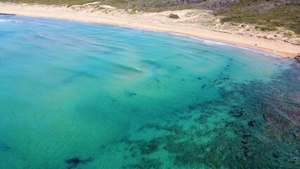 Poster - Aerial view of a sandy shore with turquoise water in Sardinia, Italy