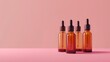 Three brown glass bottles on a pink surface. Perfect for product display or still life photography