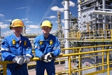 Fototapeta  - group of workers professional equipment in a petroleum refinery - modern buildings and industrial facilities for the production of fuel and gas