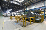 Fototapeta  - industrial plant for the production of sheet metal in a steel mill - storage of sheet rolls