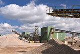 Fototapeta  - Building and conveyor system in a gravel pit - open-cast mine for sand and gravel