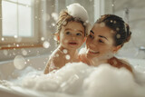 Fototapeta  - Caucasian mother bathing together with baby toddler. Cosy bathroom with natural light, mom and child playing with foam, happy and playful atmosphere. Hygiene for children, childcare. Daily routine