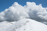 Fototapeta Do pokoju - View of the summit of Monte Calvo against a big cloud and blue sky in Abruzzo, Italy