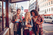 © Marko Geber - Young tourist people exploring the city with a map