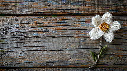 Wall Mural - Handmade White Crochet Flower on Weathered Wooden Background