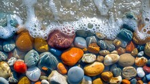 Colorful Stones In Clear Waves, Pebbles On Shore