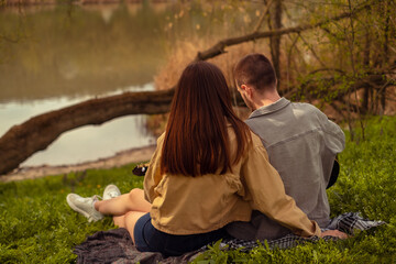 Outdoor music festival featuring a man playing guitar at a camping site. Tourist attractions, routes, and healthy outdoor activities for an active lifestyle. Valentine's Day