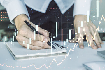 Poster - Multi exposure of abstract financial graph with hand writing in notebook on background, financial and trading concept