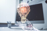 Fototapeta Nowy Jork - Double exposure of creative light bulb hologram and modern desktop with laptop on background, research and development concept