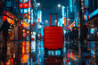 Red suitcase standing on wet road in the city at night