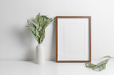Fototapeta Lawenda - Vertical wooden frame mockup with eucalyptus plant, blank mockup with copy space
