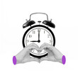 Black alarm clock with two hands showing a heart shape isolated on white background. 9 o'clock. Morning, reminder. Time concept. Trendy creative collage. Contemporary art. Modern design. Early rise