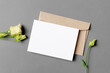 Wedding invitation card mockup with envelope and flower, top view with copy space