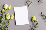 Fototapeta Lawenda - Blank invitation or greeting card mockup with fresh flowers, mockup with copy space