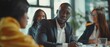 © Антон Сальников - Meeting of a diverse team of professional businesspeople in an office conference room. Black Businesswoman, African-American Digital Entrepreneur, and Hispanic CEO in conversation.