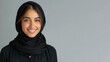 © pariketan - Arab woman wearing black ribbed V-Neck Body smiling isolated on grey