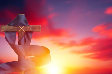 Canvas Print - The bright sunset background and wooden cross