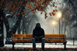 A solitary figure sits on a park bench amidst a tranquil autumn setting, exhibiting themes of loneliness and contemplation, suitable for mental health topics.